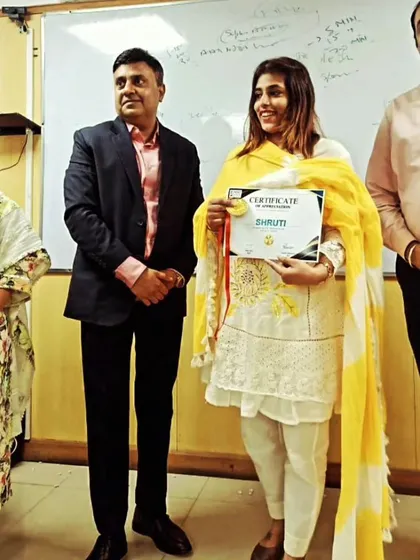 Holding a certificate of achievement, a reminder of the hard work and persistence that goes into being a successful advocate.