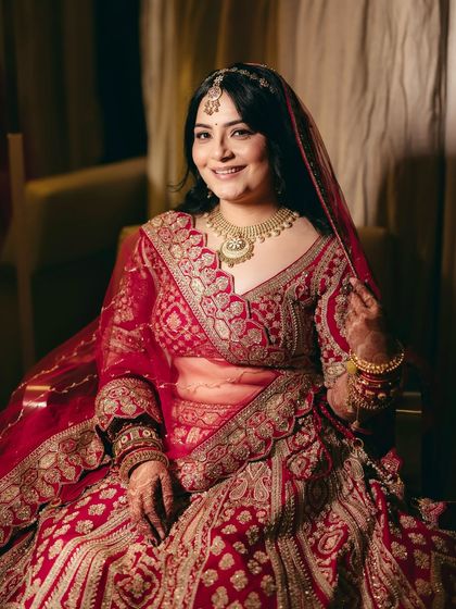 Shikha's vision was clear: open hair, nude lips, and a sharp winged eye with her red lehenga. Seeing her smile at the final result was the most rewarding part of the process.