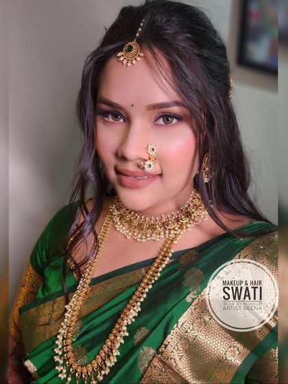 A close-up of the engagement look, highlighting the beautiful nath and the soft smokey eye makeup.