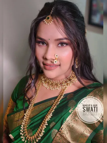 A close-up of the engagement look, highlighting the beautiful nath and the soft smokey eye makeup.
