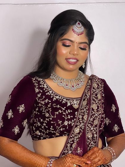 Another view of Hima's reception attire, showing how the makeup and styling come together to create a polished and complete look.