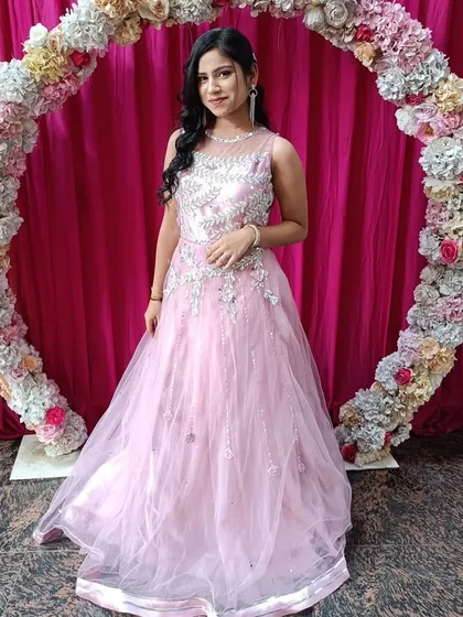 Simple, elegant, and beautiful. This client chose a light pink net gown with silver embroidery for her event. It’s a great rental option for a sophisticated evening look.
