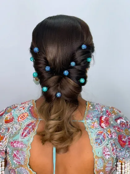 The full back view of the twisted and beaded ponytail.