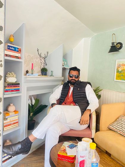 Relaxing in a well-appointed room. A poignant poem reminds us to question the ultimate purpose of accumulating wealth and fame, for death is the great equalizer.