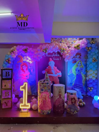 Another view of the Disney Princess birthday stage, highlighting the different lighting effects on the balloon arch and backdrops.