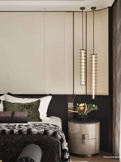 A close-up on the bespoke bedside setup, featuring a marble-topped nightstand and elegant pendant lights. This detail highlights our focus on combining high-end materials with functional, beautiful lighting design.