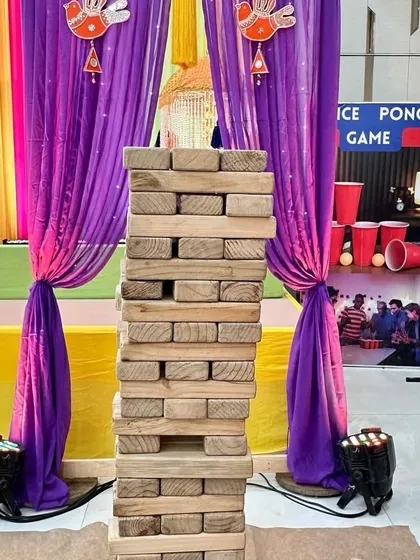 Adding games like this giant Jenga tower is a great way to entertain guests during a lively Mehendi or Haldi function.