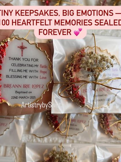 Tiny keepsakes, big emotions. Holding one of the finished baptism favors next to its beautiful packaging.