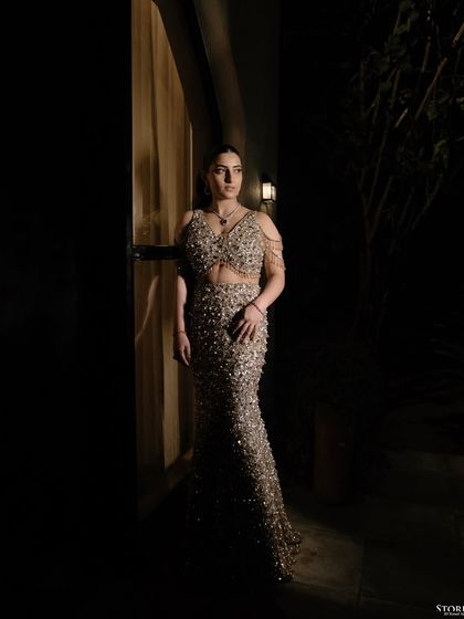 An artistic portrait of the bride, her pose and the lighting creating a high-fashion, editorial look.