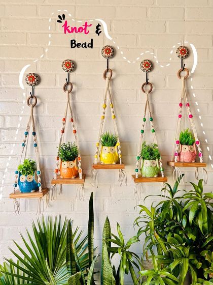 A beautiful lineup of our 'Knot & Bead' wall shelves in five different colors. These shelves are perfect for small planters and look great when styled with our best-selling ceramic owl planters.