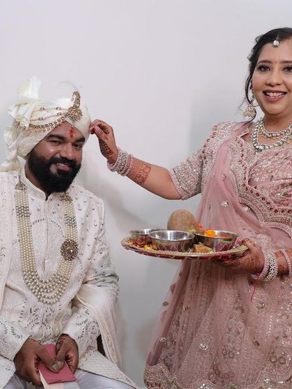 Another angle of the sister performing the ritual. The makeup is designed to look fresh throughout the event.