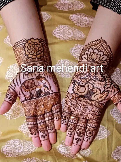 This design for a mom-to-be features majestic elephants, which symbolize good luck and strength, alongside graceful swan and floral patterns.
