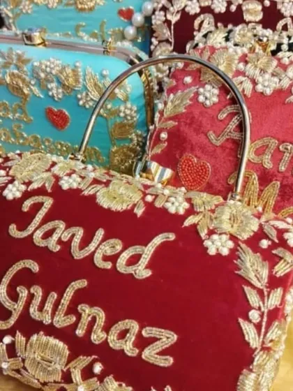 To show you the possibilities, here are a few of my personalized bridal clutches together. You can see different colors like deep red and turquoise, and various embroidery styles for the couple's names. Each one is made with so much love and care.