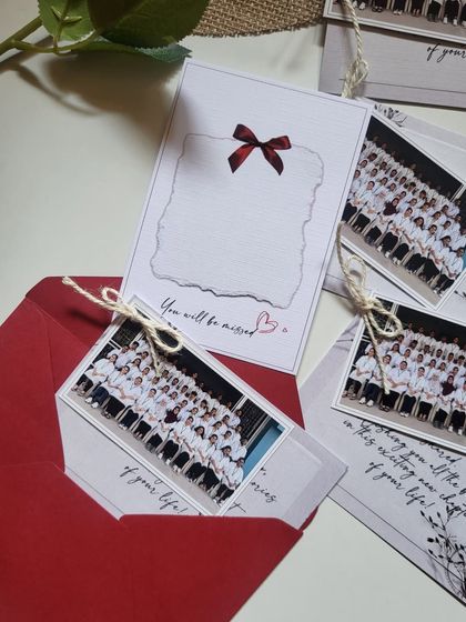 Farewell tokens for the Class of 2025. These cards feature a group photo and a space for a handwritten note, all tucked into a classic red envelope.
