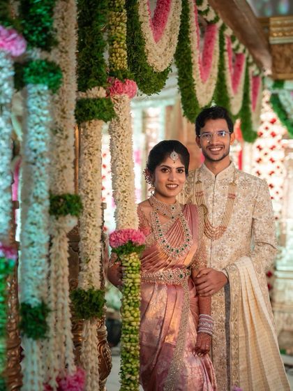 This bride's pastel pink engagement saree is pure elegance. The professional photos highlight how the drape complements the decor and the couple's style, looking perfect from every angle.