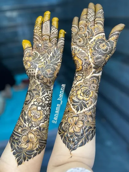 This is what my full bridal mehndi is all about. I cover both hands from the fingertips to the forearms with extremely detailed floral and traditional patterns. Notice the mix of bold shading and delicate lines that make the design pop.