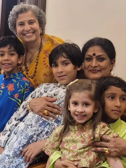 With the children of my disciples. Being a guru means being a part of their lives, sharing in their joys and watching their families grow.