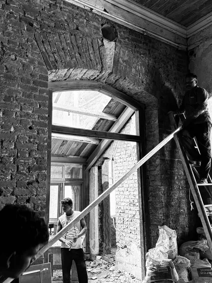 The process of restoration is often a delicate, high wire act. Here, our team works on an exposed brick archway, carefully bringing back the structural and aesthetic integrity of the original design.