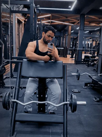 Taking a moment to rest and check my form. Proper technique is just as important as lifting heavy.