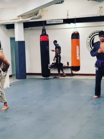 The attitude you need to succeed. A newly promoted blue belt celebrating her achievement after the open mat.