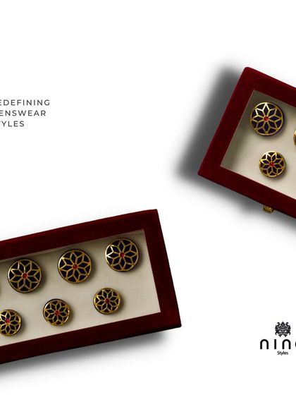 Even the buttons we use are chosen with care. This image shows our ornate, custom-designed buttons that can be used on bespoke jackets, adding another layer of detail to a very special gift.