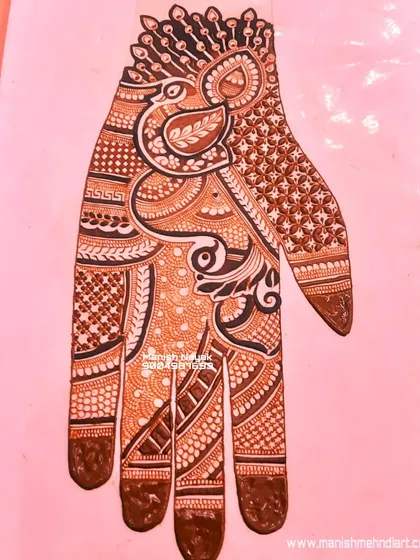 A full-hand bridal design on a practice sheet. This allows me to perfect the layout and flow of the design before applying it to a bride's hand.