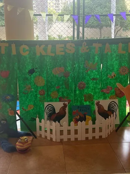 My farm-themed setup ready for a birthday party. The big rooster and the white picket fence add a lovely touch to the scene.