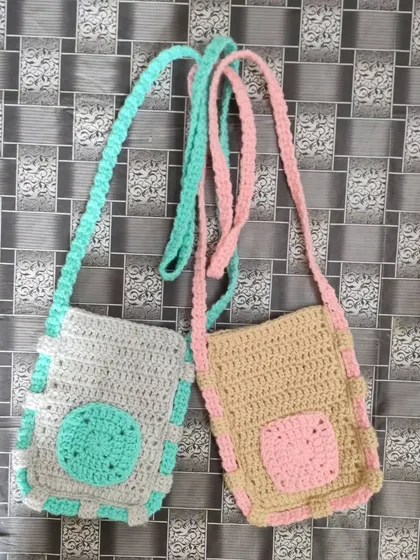 Here are two of my handmade sling bags. They are made with a mix of colours like grey and mint green, and beige and pink. They are a great size for carrying your phone or other small things.
