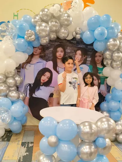 Friends posing together at a themed birthday party. It's a great opportunity for kids to have fun with their best buddies.