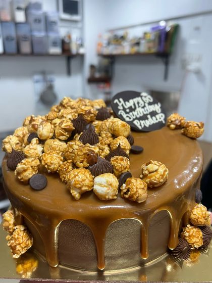 My Belgian Chocolate Salted Caramel cake. The caramel drip on this is pure food porn. It's topped with caramel popcorn and chocolate details for extra crunch and decadence.