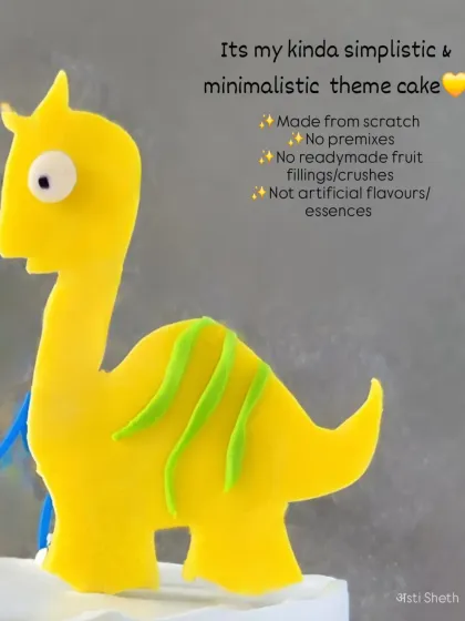 A close-up of the handmade fondant dinosaur topper, showing the simple, clean lines that make my minimalist theme cakes special.