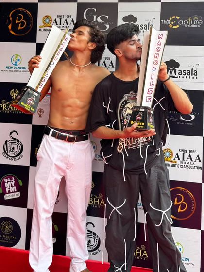 Kissing the trophies. A moment of pure joy and validation for the endless hours of practice.