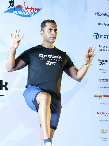 Another shot from the stage, demonstrating warm-up movements for thousands of runners.
