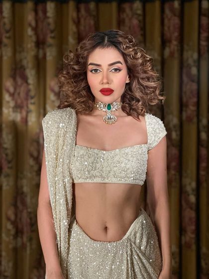 Another shot of this powerful look. The red lip and emerald choker are a match made in heaven.