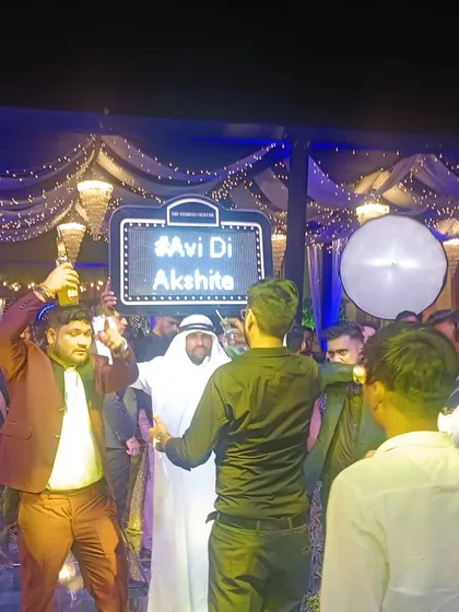I bring the party to the dance floor with our famous "Habibi" act, serving shots and getting everyone hyped. We can even include a custom light-up sign with your wedding hashtag.
