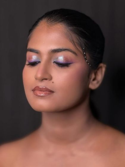 Another angle of the color pop look, showing the glossy lip and glowing skin that balances the dramatic eye makeup.