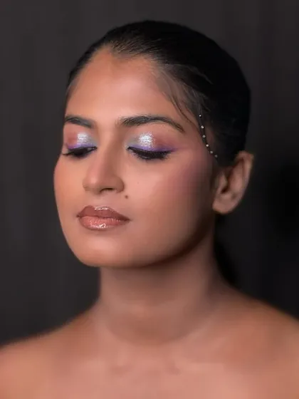 Another angle of the color pop look, showing the glossy lip and glowing skin that balances the dramatic eye makeup.