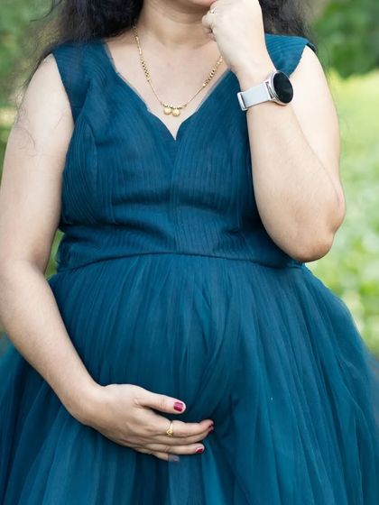 A close-up of the pleated bodice on my turquoise maternity gown. The careful pleating provides a comfortable and flattering fit over the baby bump.