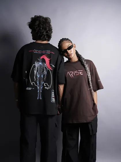 This shot captures the essence of a streetwear collection with two models in anime-inspired graphic tees. The cool, laid-back poses and styling are perfectly targeted for a young, fashion-conscious audience.