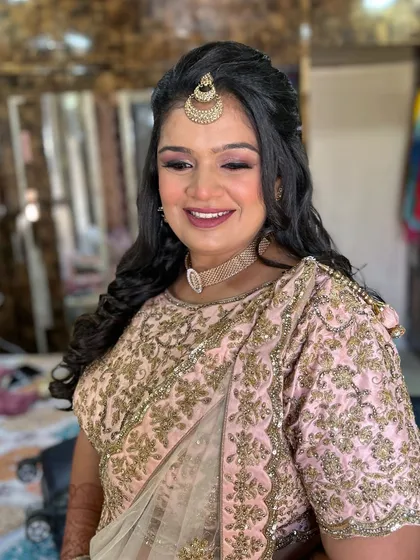 A candid shot capturing her happiness. This look is perfect for a sangeet or engagement party.