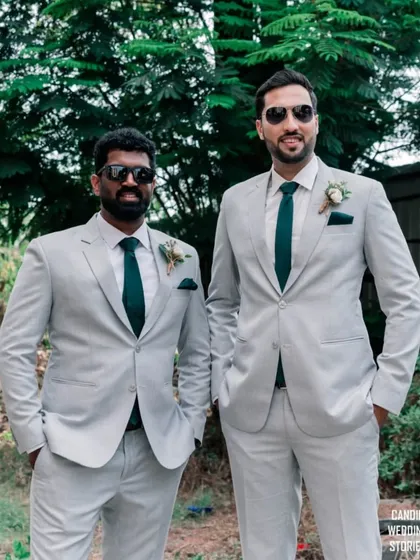 The groom and his best man looking cool and relaxed in their matching suits and sunglasses before the ceremony.
