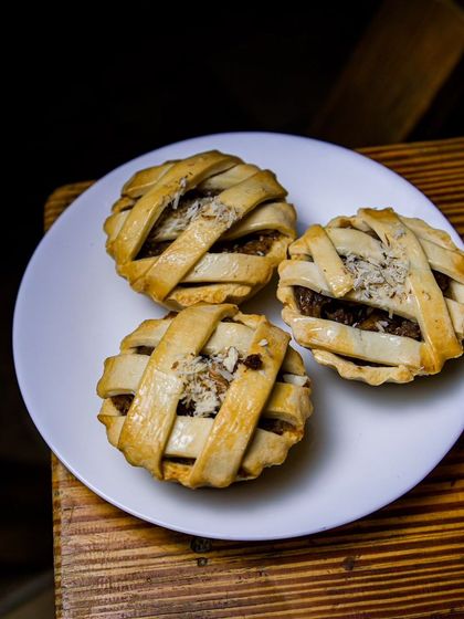 Three of my mini apple pies, ready to be enjoyed. The lattice crust is golden brown, and the filling is packed with juicy, cinnamon-spiced apples. A perfect single-serving dessert.