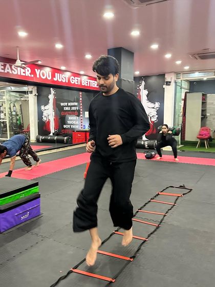A student works on his agility and footwork using a speed ladder during one of our circuit training sessions.