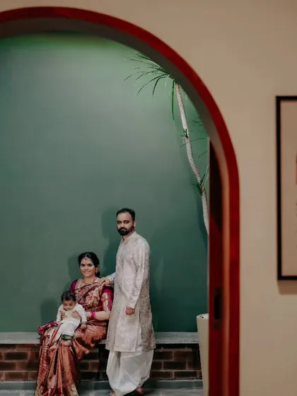 I love using a venue's architecture to create artistic and modern family portraits. Here, the family is framed by an archway, creating a quiet, beautifully composed image that feels both intimate and grand.