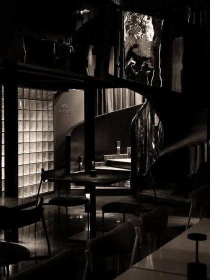 At Lair, a speakeasy in Gurgaon, the design is about creating a clandestine experience. This sculptural, reflective spiral staircase is the central artery of the space, a mysterious form that guides guests through a journey of concealment and discovery.