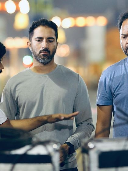 In discussion with the director and crew. We are constantly refining the sequence to make it better, ensuring the action supports the emotional core of the scene.
