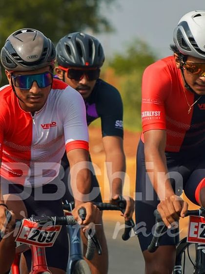 A group of elite riders navigate a section of the course together. The concentration required in a Criterium is immense, with no room for error.