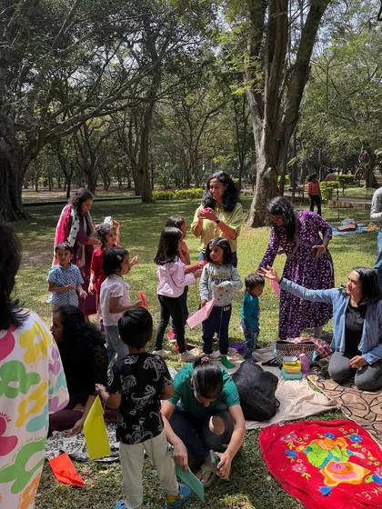 A wide shot of our group during a celebration, with kids and parents engaged in various activities. You can see the dynamic and lively nature of our sessions.