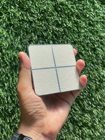 A handheld shot of my white leather-finish luxury touch switch. The texture and quality are designed to provide a premium tactile experience.