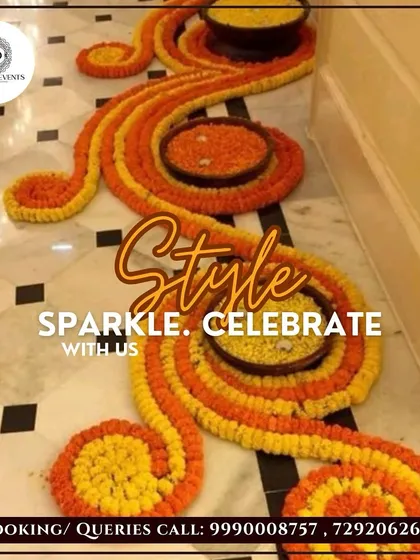 Traditional floor decorations, or rangoli, are a beautiful part of Diwali. Here is an intricate pattern I created using fresh orange and yellow marigold petals, adding a classic and welcoming touch to the event entrance.